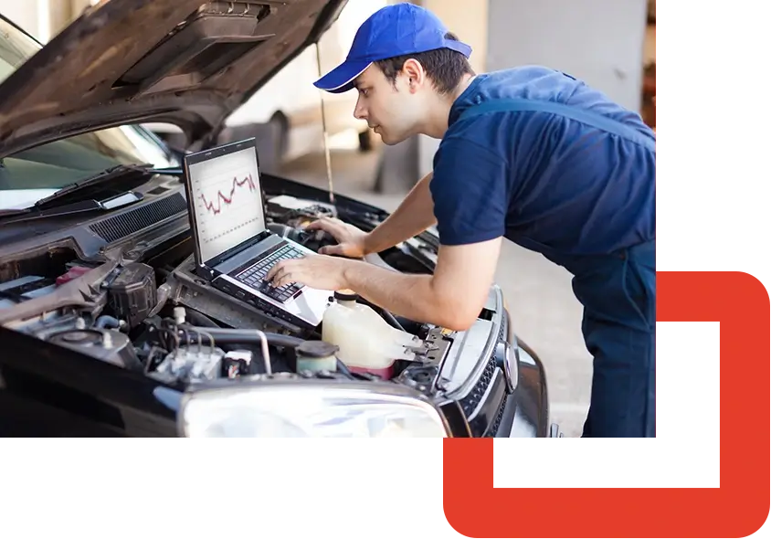 PAC-Mechanic using a laptop computer to check a car engines