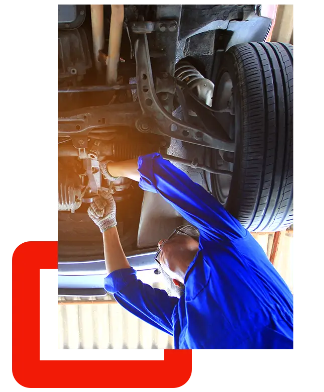 PCC-car-mechanic-working-under-car-in-auto-repair-service